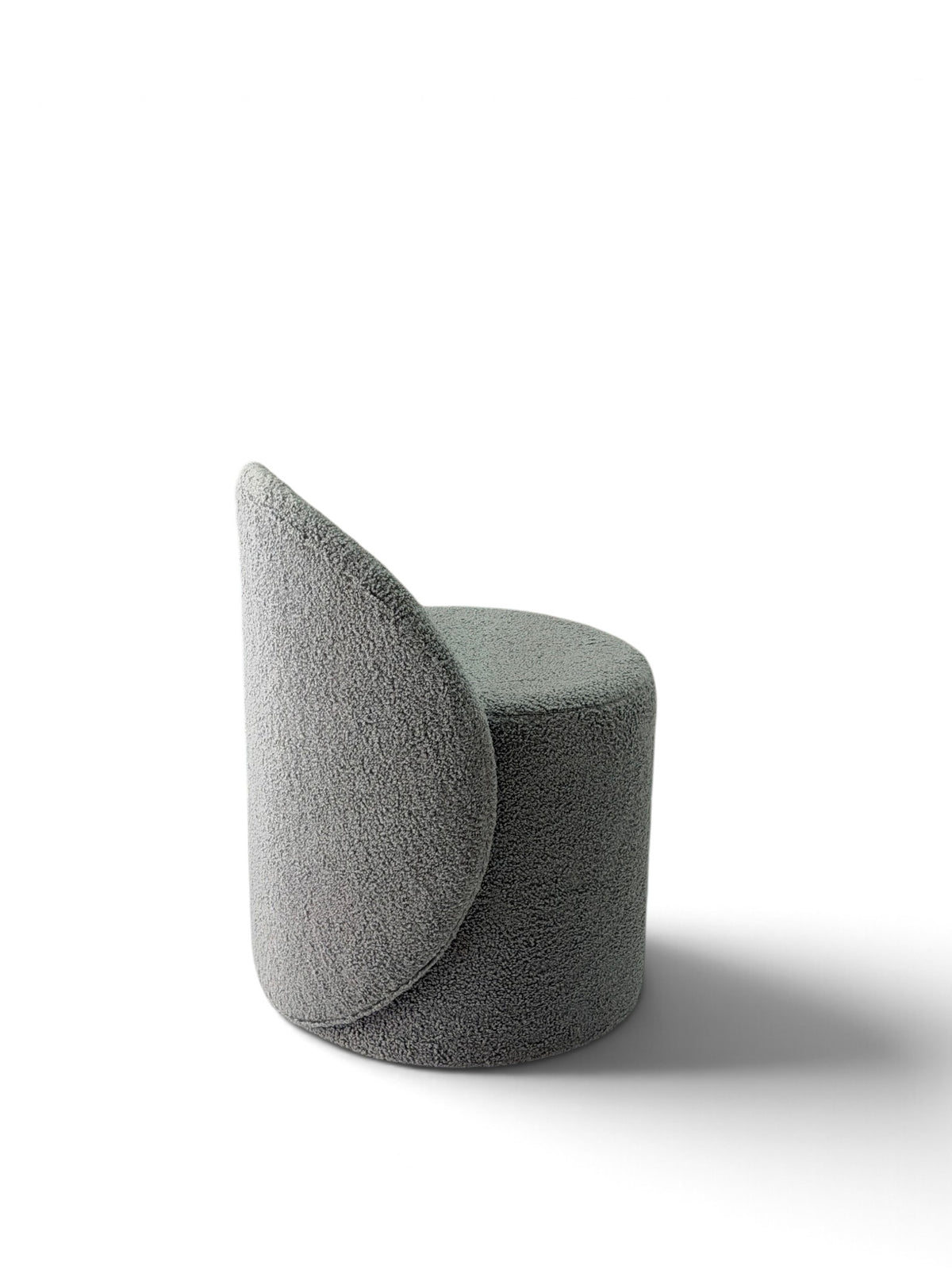 Prisma bouclé accent chair in grey on a white background