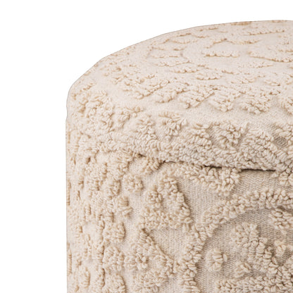 Casa Verve Furniture cream textured round bohemian ottoman with raised floral patterns, perfect as a footrest or accent seating.