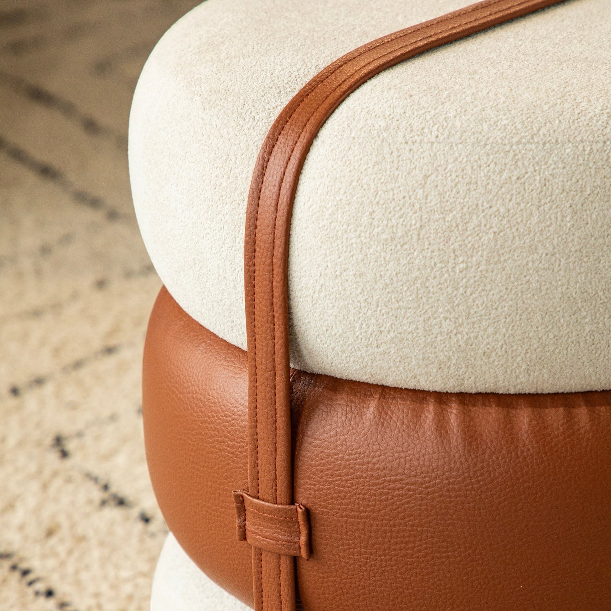 Casa Verve Furniture Terraroza Ottoman: stacked cream textured fabric and tan PU leather cushions with brown leather strap detail.