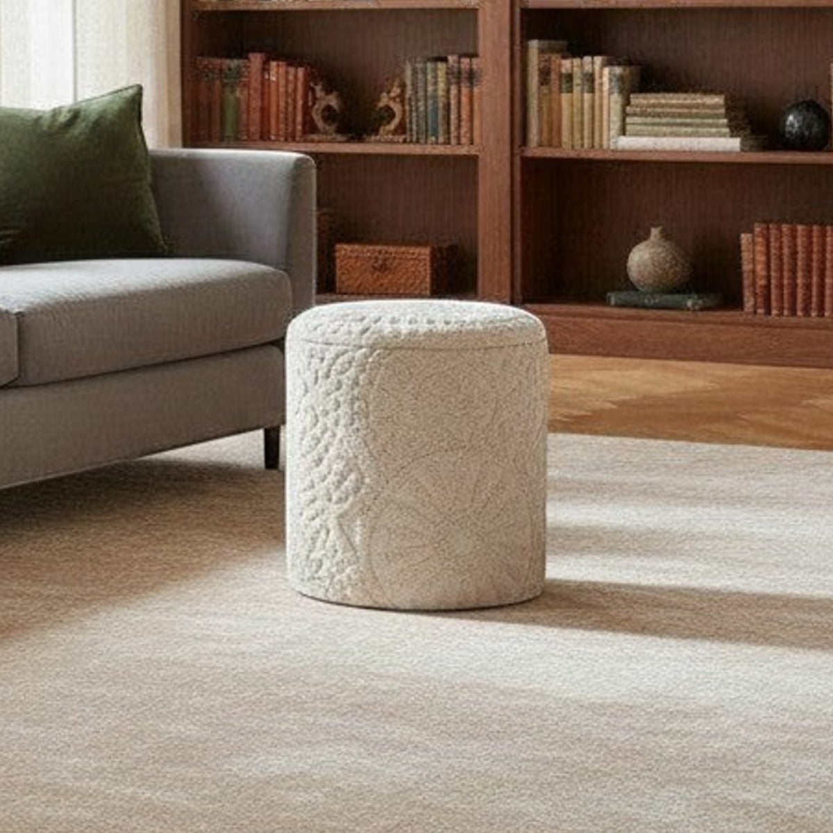 Casaverve Bohemian Textured Round Ottoman in cream, styled beside a grey sofa in a living room