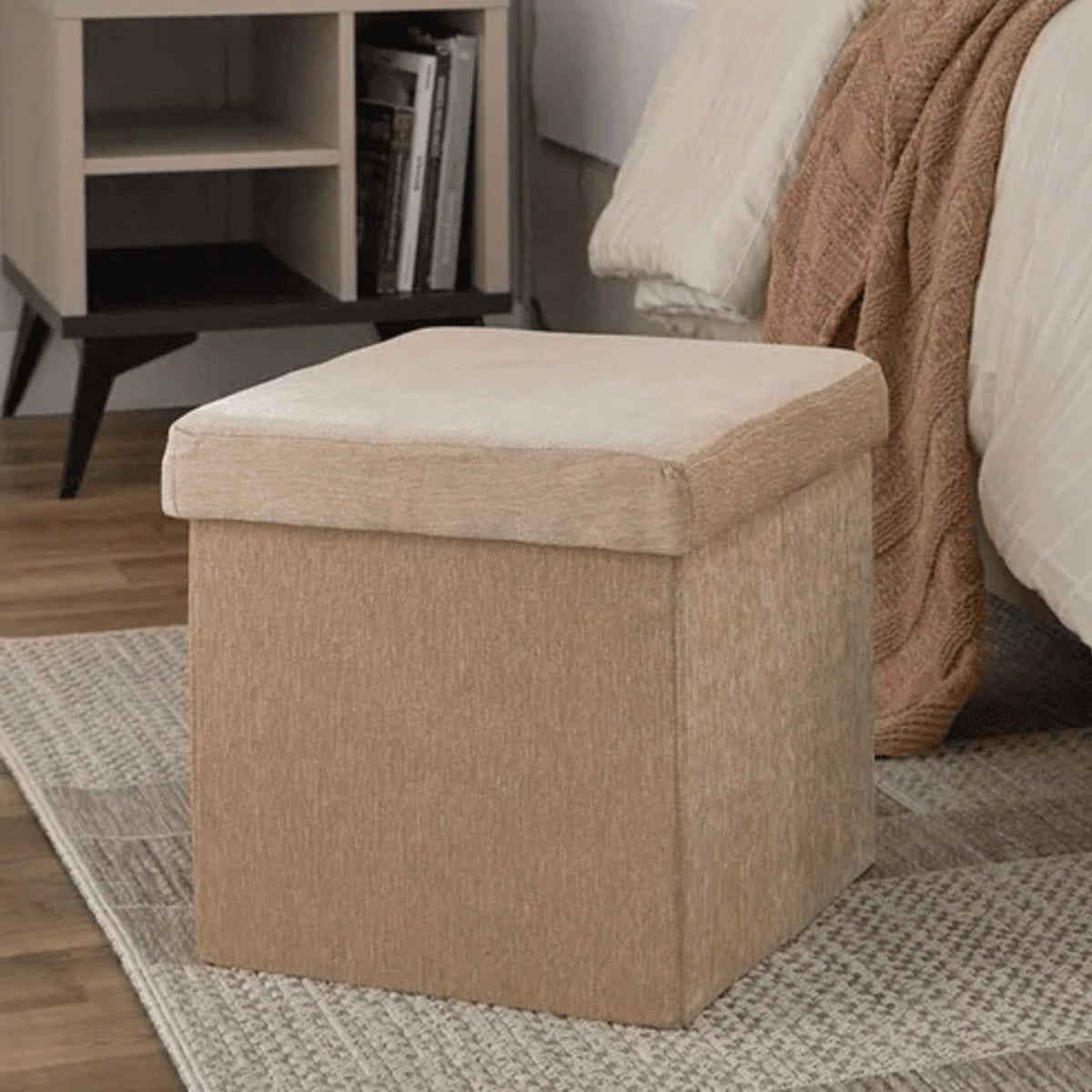 Casaverve Flip & Fold Storage Ottoman in beige, placed at the foot of a bed