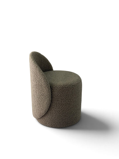 Prisma bouclé accent chair in beige on a white background