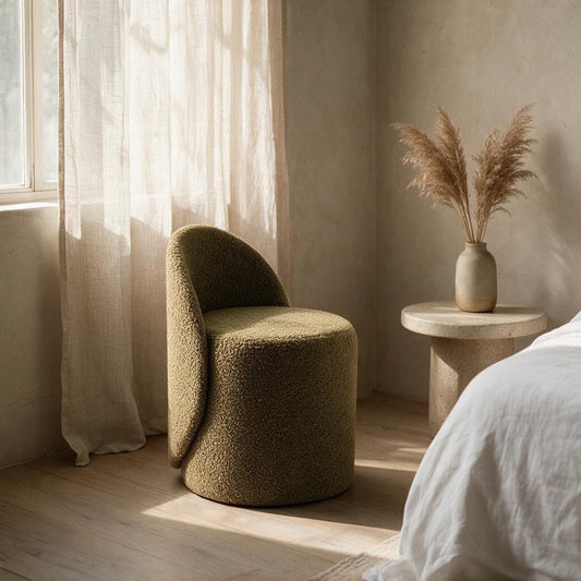 Prisma bouclé accent chair in camel styled in a sunlit Indian bedroom