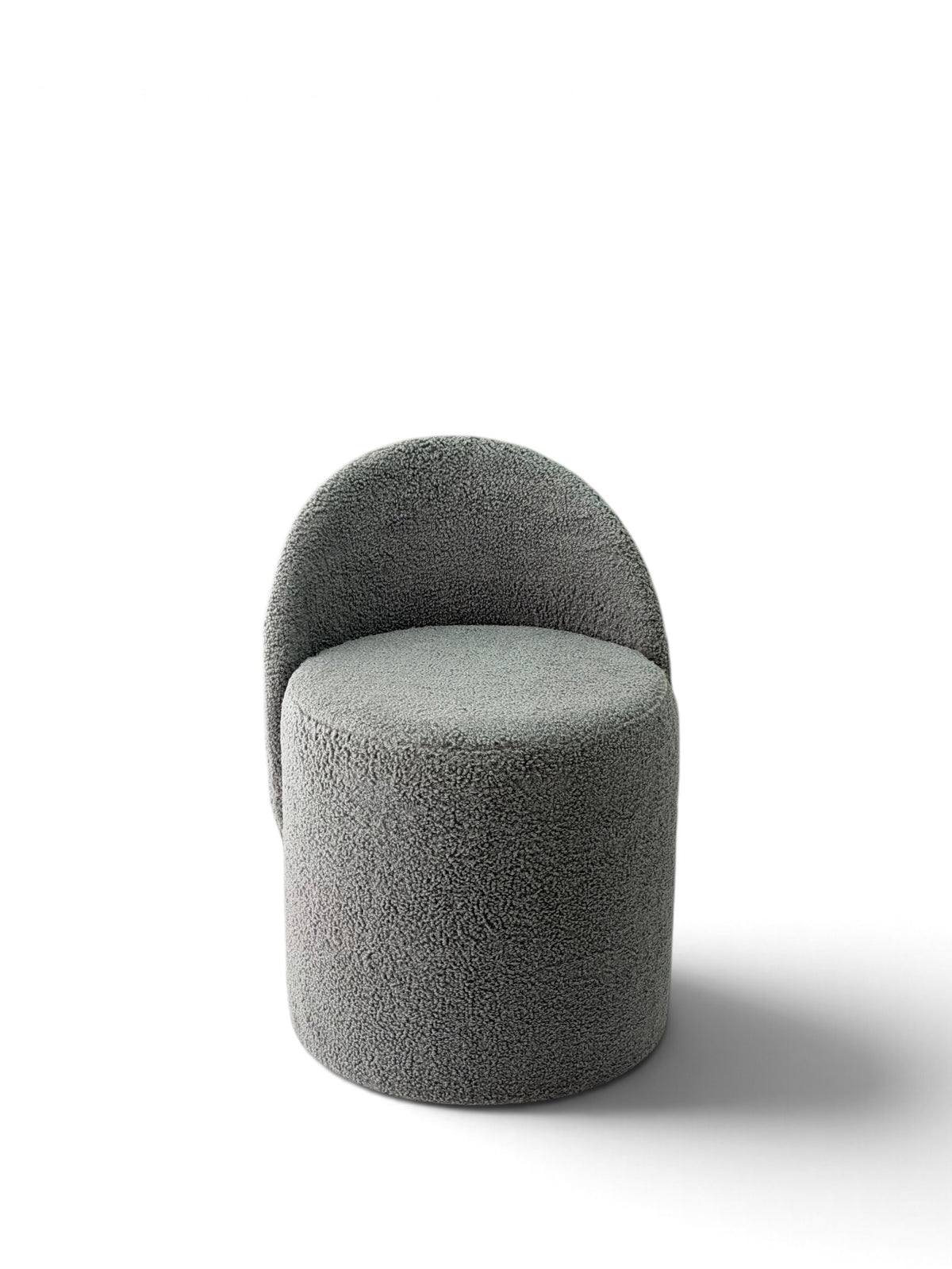 Prisma bouclé accent chair in grey on a white background