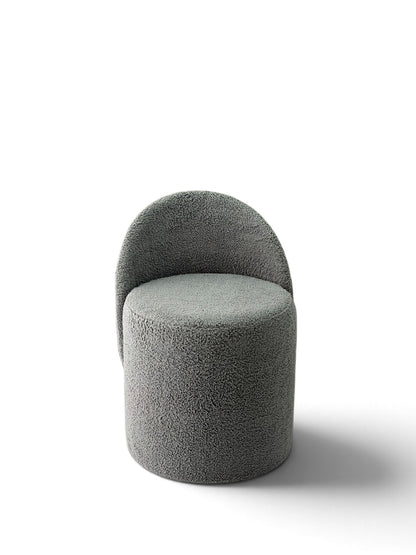 Prisma bouclé accent chair in grey on a white background
