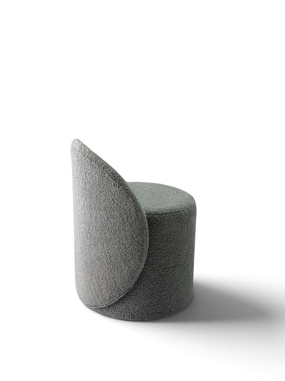 Prisma bouclé accent chair in grey on a white background