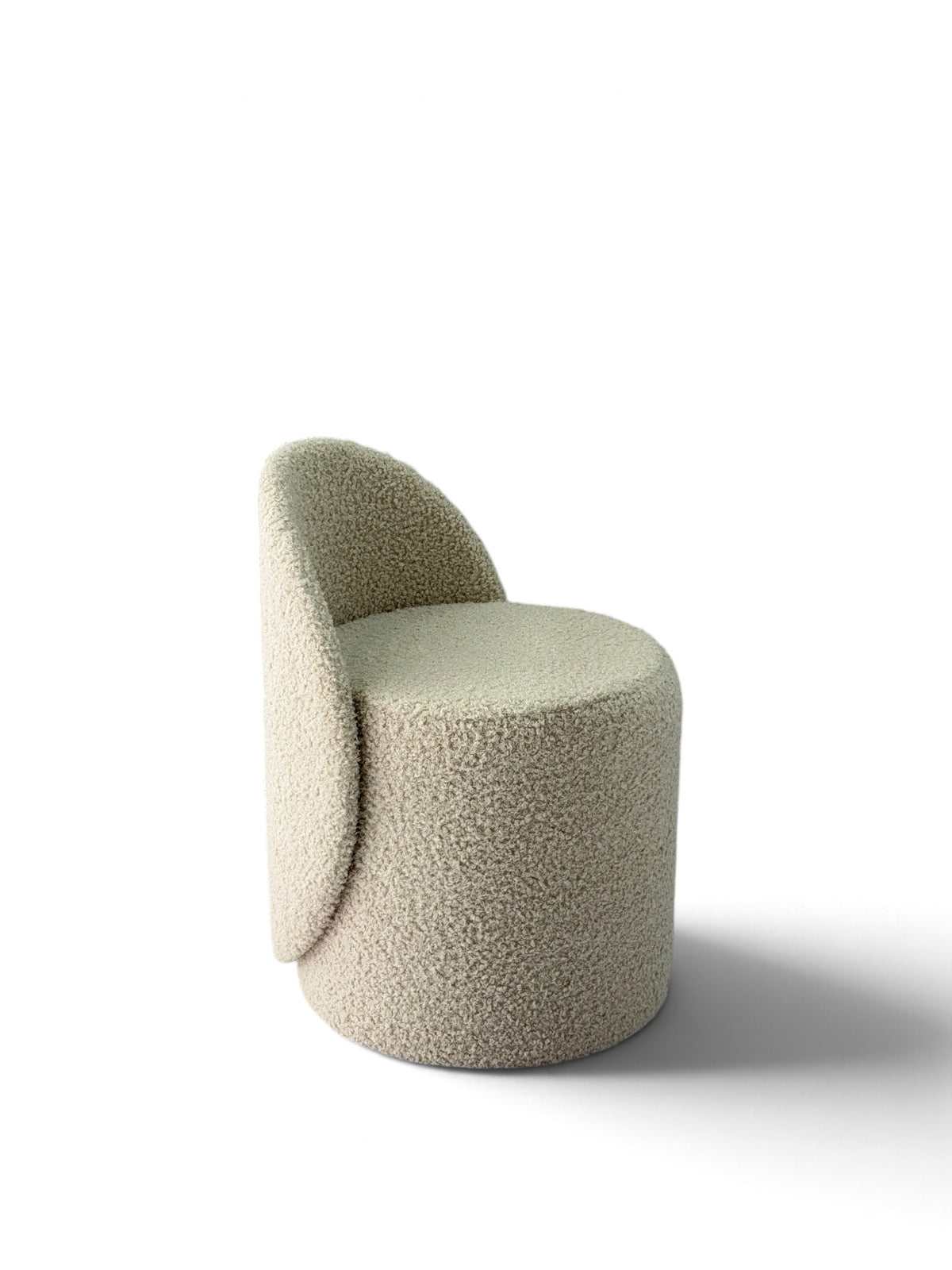 Prisma bouclé accent chair in ivory on a white background