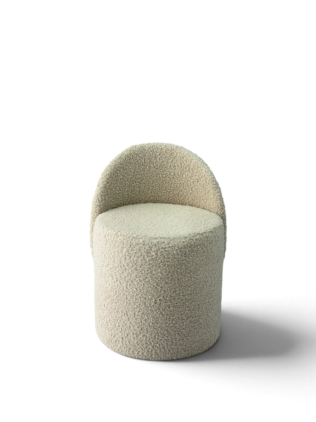 Prisma bouclé accent chair in ivory on a white background