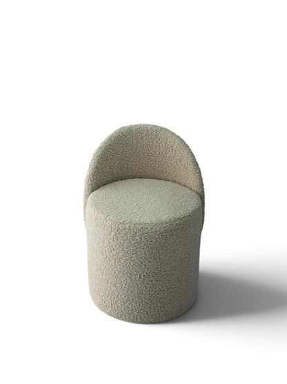 Prisma bouclé accent chair in ivory on a white background