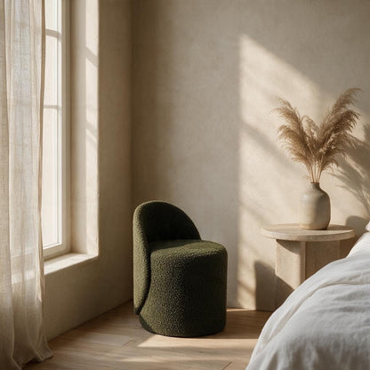Prisma bouclé accent chair in olive styled in a sunlit Indian bedroom