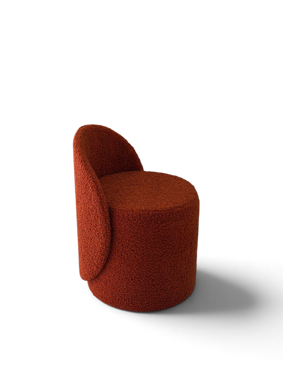 Prisma bouclé accent chair in terracotta on a white background