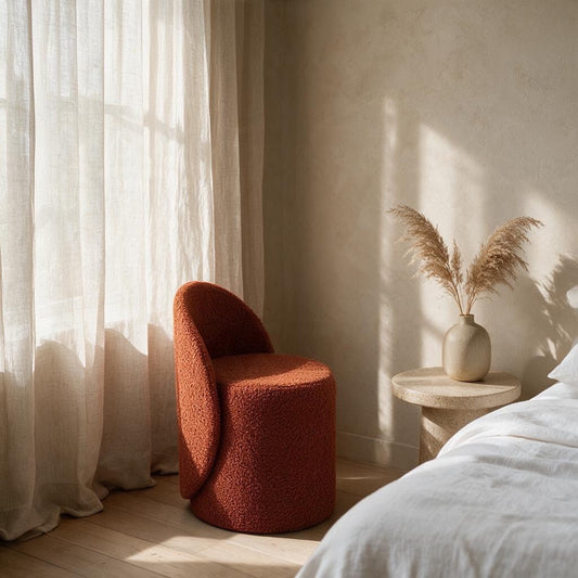 Prisma bouclé accent chair in terracotta styled in a sunlit Indian bedroom