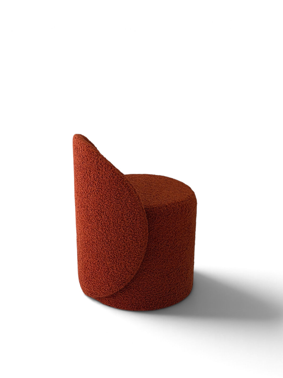 Prisma bouclé accent chair in terracotta on a white background