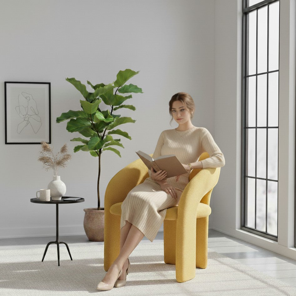 Casa Verve Furniture Auria modern lounge chair in mustard yellow corduroy fabric, with a woman reading.